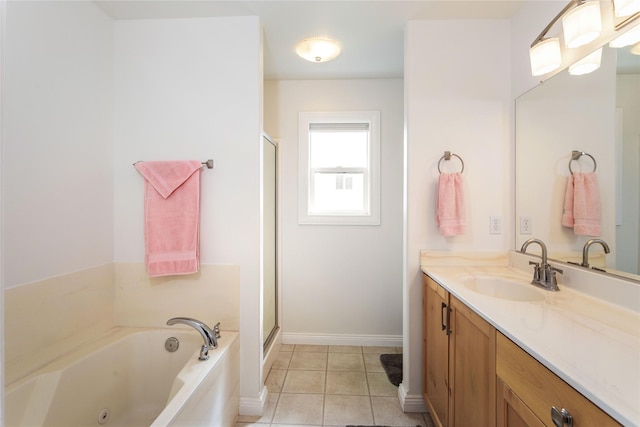 173 Empire Loop, Kalispell, MT 59901 - bathroom with a jetted tub, vanity, a stall shower, tile patterned floors, and baseboards