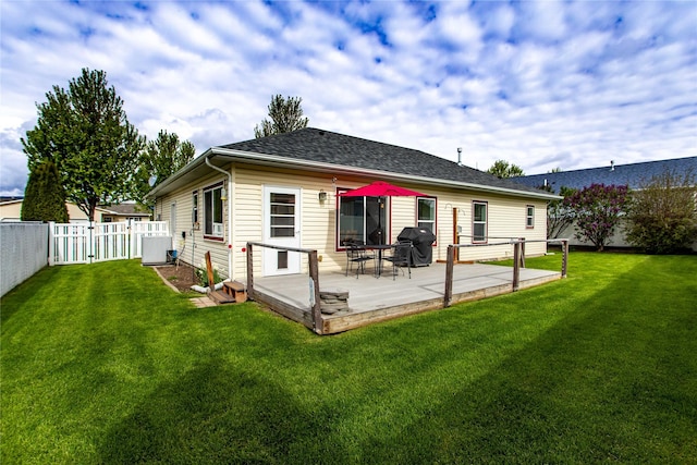 173 Empire Loop, Kalispell, MT 59901 - rear view of house with central AC unit, a wooden deck, a gate, and roof with shingles