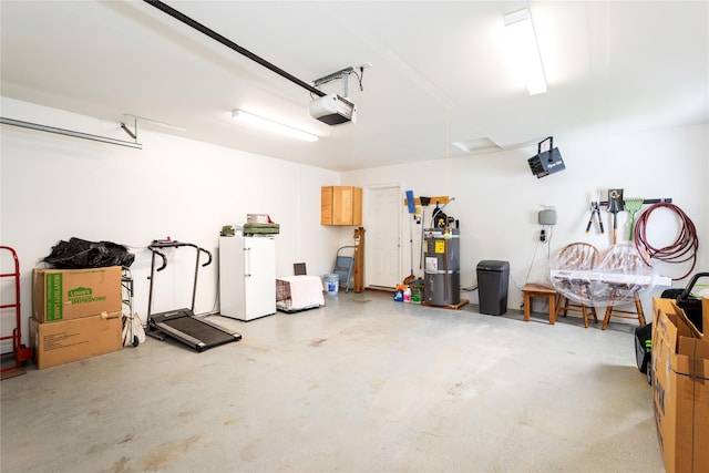 173 Empire Loop, Kalispell, MT 59901 - garage featuring a garage door opener and secured water heater