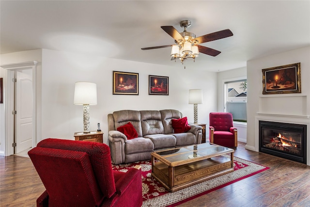 173 Empire Loop, Kalispell, MT 59901 - living room featuring a ceiling fan, wood finished floors, a glass covered fireplace, and baseboards
