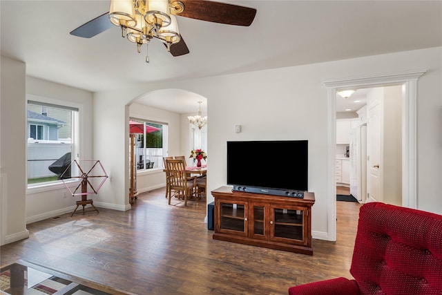 173 Empire Loop, Kalispell, MT 59901 - living area with ceiling fan, arched walkways, wood finished floors, and a chandelier