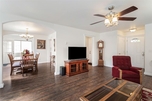 173 Empire Loop, Kalispell, MT 59901 - living room featuring arched walkways, a ceiling fan, dark wood-type flooring, and baseboards