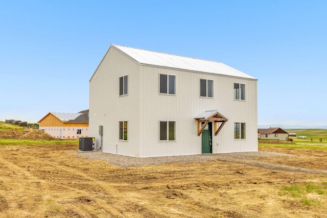 28 Mackenzie Mountain Way, Three Forks, MT 59752 - view of front of property featuring metal roof and central AC