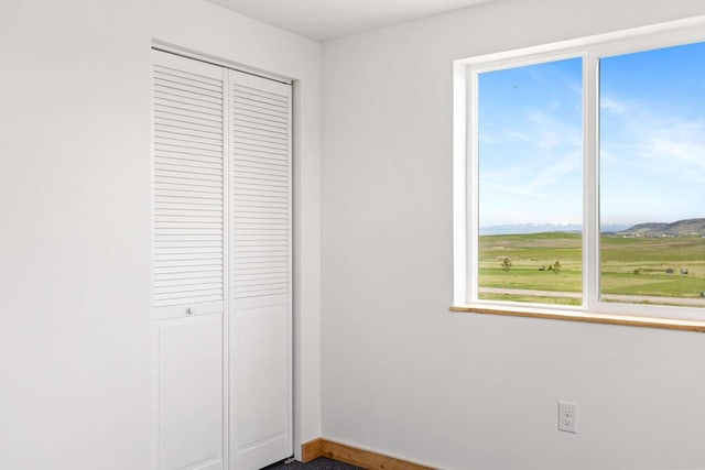 28 Mackenzie Mountain Way, Three Forks, MT 59752 - unfurnished bedroom featuring a closet and baseboards