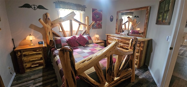 194 Whitetail Dr, Haugan, MT 59842 - bedroom with dark wood-type flooring and baseboards