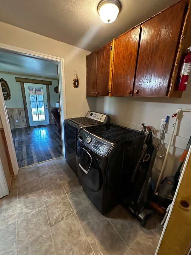 194 Whitetail Dr, Haugan, MT 59842 - laundry room with cabinet space, independent washer and dryer, and a textured ceiling
