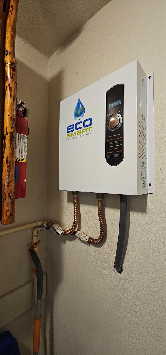 194 Whitetail Dr, Haugan, MT 59842 - detailed view of tankless water heater and a fire extinguisher