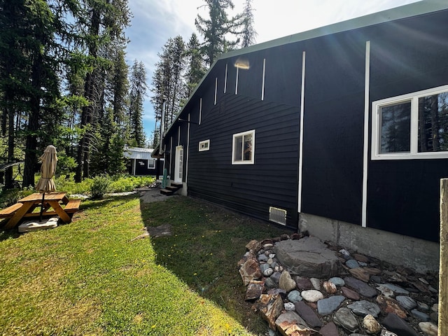 194 Whitetail Dr, Haugan, MT 59842 - view of property exterior with entry steps and a yard