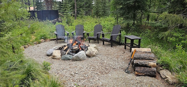 194 Whitetail Dr, Haugan, MT 59842 - view of yard featuring an outdoor fire pit