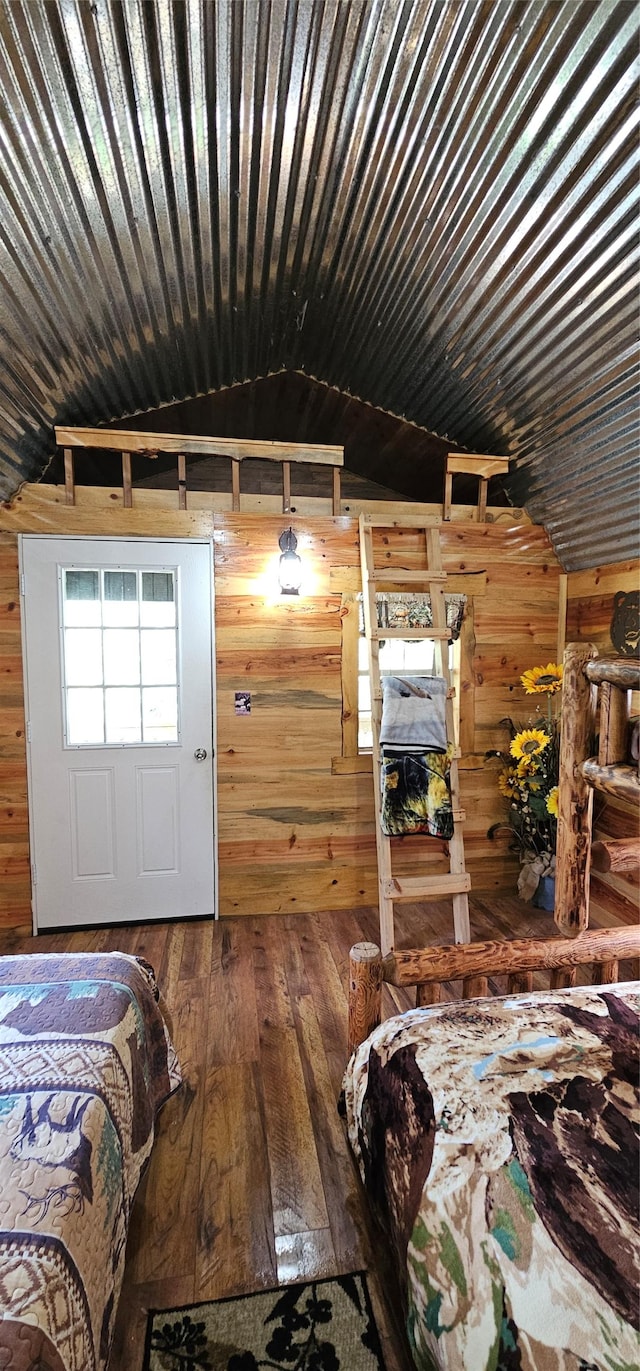 194 Whitetail Dr, Haugan, MT 59842 - bedroom featuring wood walls, hardwood / wood-style floors, lofted ceiling, and wood ceiling