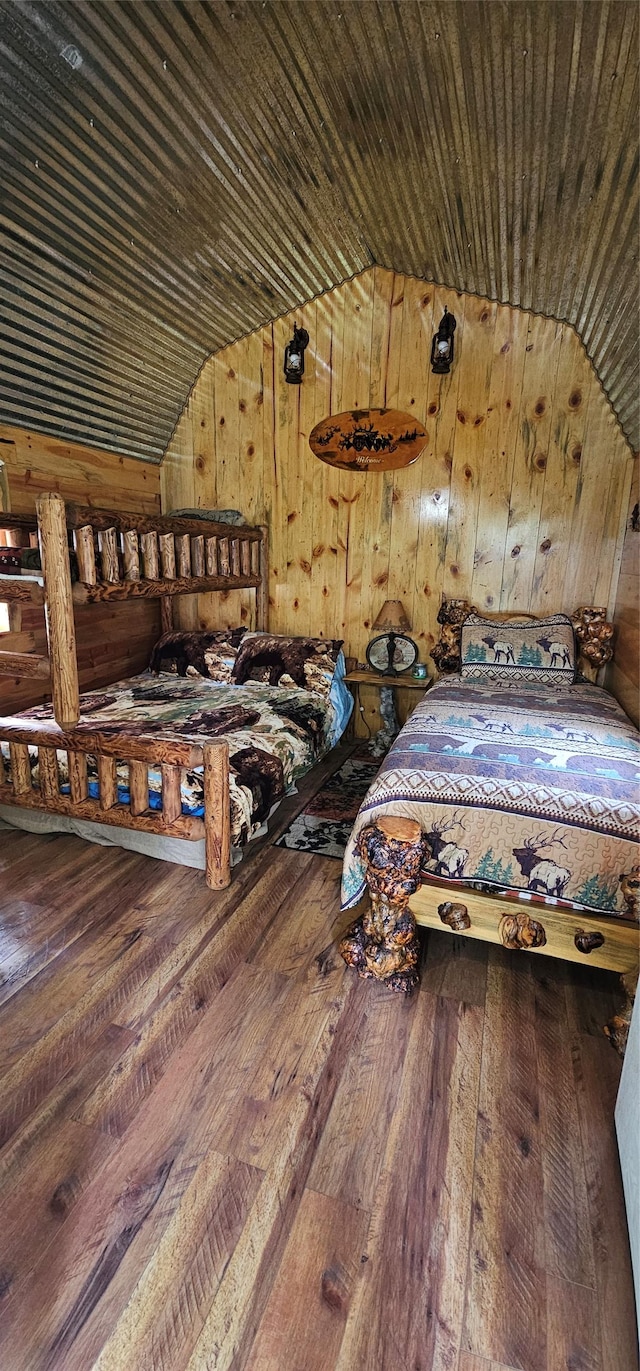 194 Whitetail Dr, Haugan, MT 59842 - bedroom featuring vaulted ceiling, wood walls, and wood-type flooring