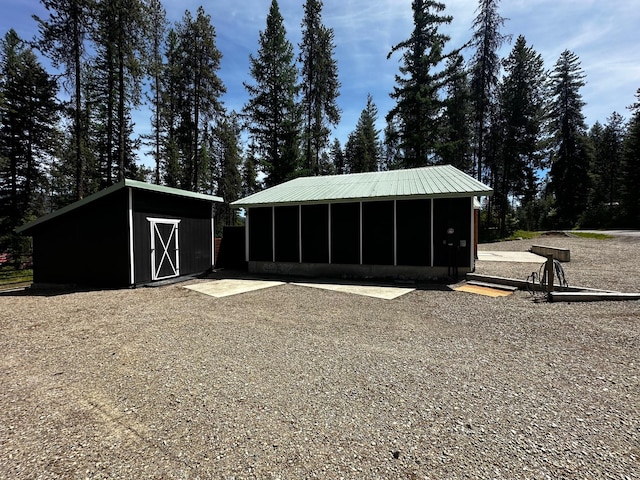 194 Whitetail Dr, Haugan, MT 59842 - view of shed featuring a sunroom