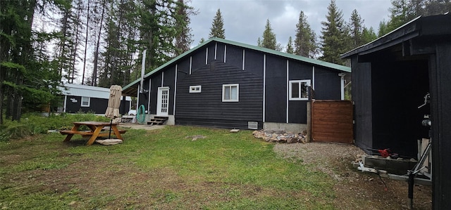 194 Whitetail Dr, Haugan, MT 59842 - back of property featuring entry steps and a yard