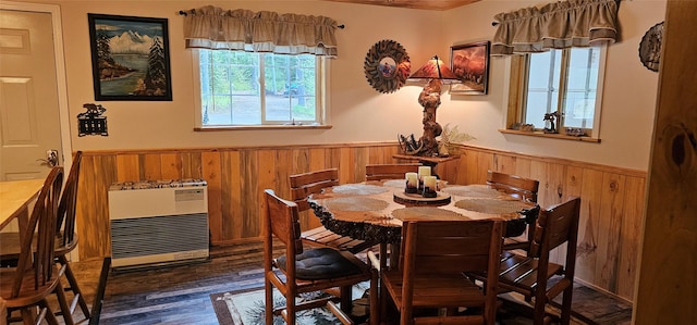 194 Whitetail Dr, Haugan, MT 59842 - dining space with wooden walls, a wainscoted wall, wood finished floors, and heating unit