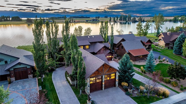 237 Harbor Dr, Bigfork, MT 59911 - aerial view at dusk of a water view and a residential view