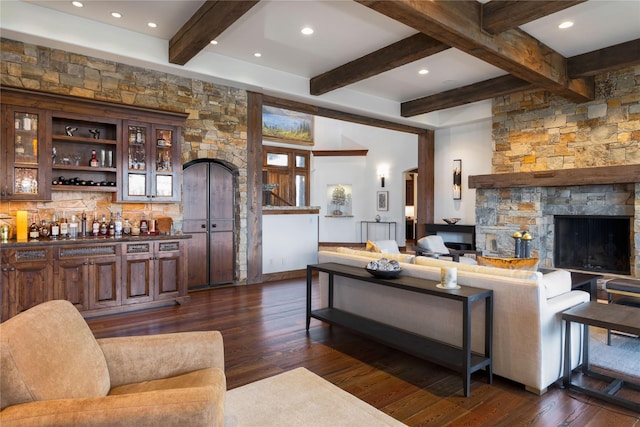 237 Harbor Dr, Bigfork, MT 59911 - living room featuring dark wood-style flooring, beamed ceiling, bar area, a fireplace, and recessed lighting