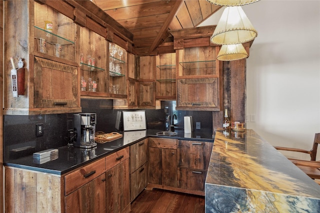 237 Harbor Dr, Bigfork, MT 59911 - kitchen featuring wooden ceiling, dark wood-type flooring, decorative backsplash, a sink, and dark countertops