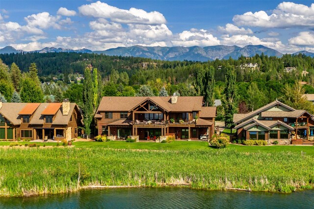 237 Harbor Dr, Bigfork, MT 59911 - mountain view with a nearby body of water and a heavily wooded area