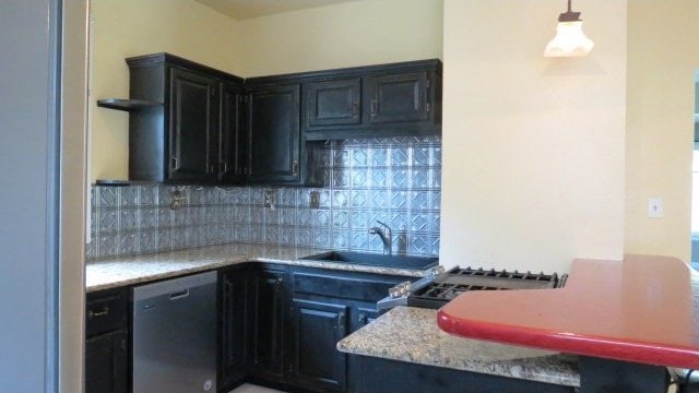 726 4th Ave S, Great Falls, MT 59405 - kitchen with dishwasher, tasteful backsplash, a sink, pendant lighting, and dark cabinets