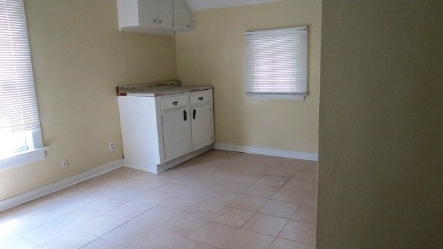 726 4th Ave S, Great Falls, MT 59405 - spare room with baseboards and light tile patterned floors