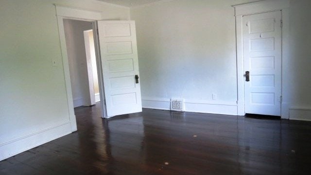 726 4th Ave S, Great Falls, MT 59405 - unfurnished room with baseboards and dark wood finished floors