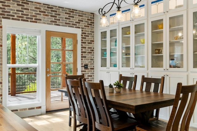 11501 Sleeman Creek Rd, Lolo, MT 59847 - dining room with brick wall