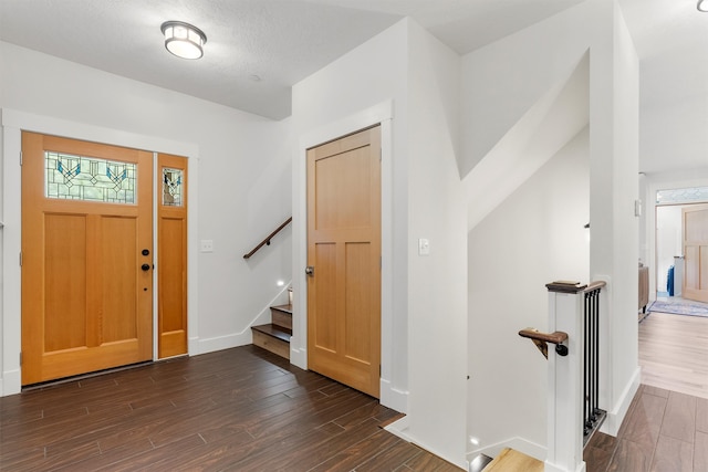 11501 Sleeman Creek Rd, Lolo, MT 59847 - foyer with dark wood-style flooring and stairway