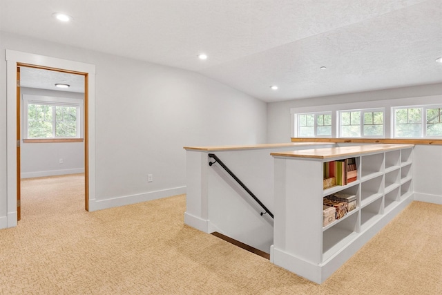11501 Sleeman Creek Rd, Lolo, MT 59847 - hallway with an upstairs landing, light colored carpet, and recessed lighting