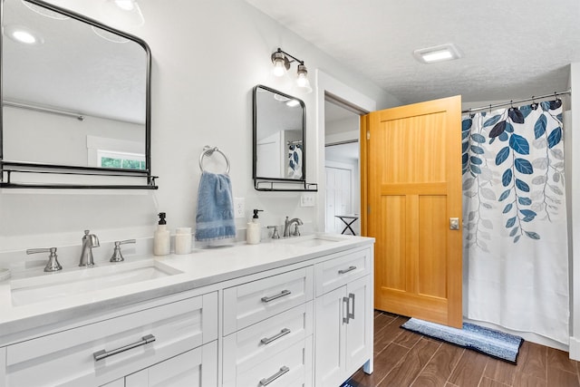 11501 Sleeman Creek Rd, Lolo, MT 59847 - bathroom with double vanity, a shower with curtain, and wood finished floors