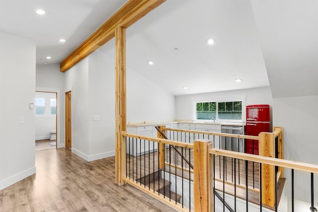 11501 Sleeman Creek Rd, Lolo, MT 59847 - corridor featuring an upstairs landing, light wood finished floors, and recessed lighting