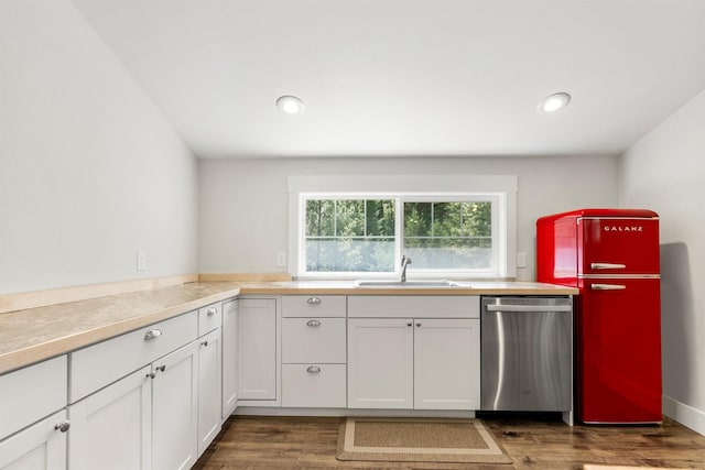 11501 Sleeman Creek Rd, Lolo, MT 59847 - kitchen with stainless steel dishwasher, fridge, dark wood finished floors, white cabinets, and light countertops