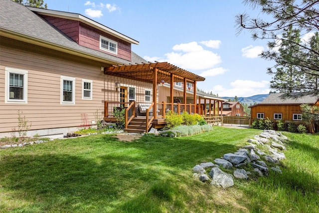 11501 Sleeman Creek Rd, Lolo, MT 59847 - back of house with a pergola, a deck with mountain view, and roof with shingles