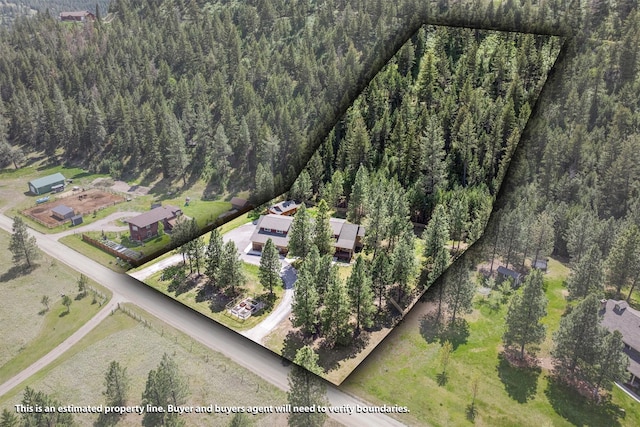 11501 Sleeman Creek Rd, Lolo, MT 59847 - aerial view of property and surrounding area featuring a heavily wooded area