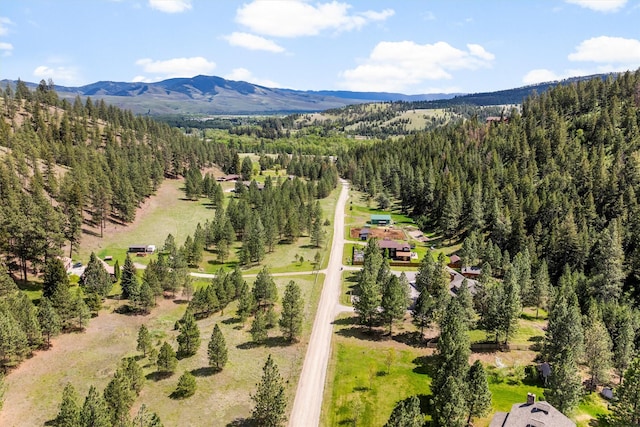 11501 Sleeman Creek Rd, Lolo, MT 59847 - drone / aerial view of a heavily wooded area and mountains