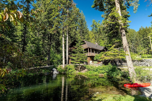 151 Handkerchief Creek Dr, Kalispell, MT 59901 - view of yard with a wooded view and a balcony