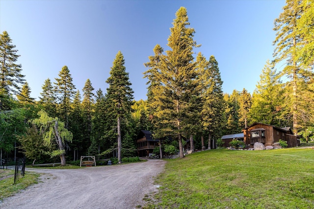 151 Handkerchief Creek Dr, Kalispell, MT 59901 - view of dirt / gravel road featuring a wooded view