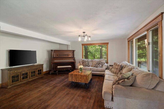 151 Handkerchief Creek Dr, Kalispell, MT 59901 - living room featuring dark wood-type flooring and a chandelier