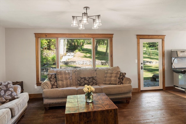 151 Handkerchief Creek Dr, Kalispell, MT 59901 - living area with healthy amount of natural light, a chandelier, and dark wood-style flooring
