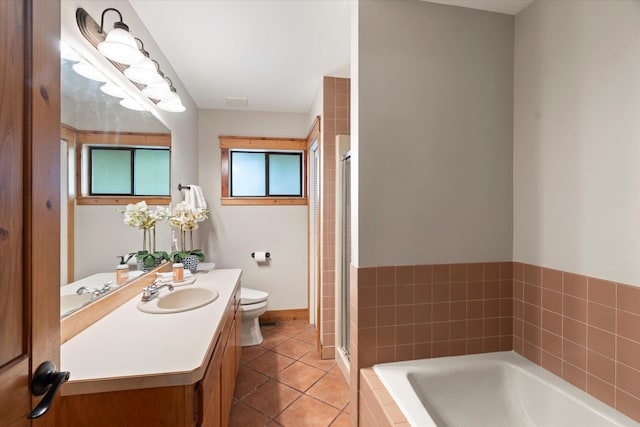 151 Handkerchief Creek Dr, Kalispell, MT 59901 - full bathroom featuring vanity, a garden tub, tile patterned floors, and a stall shower