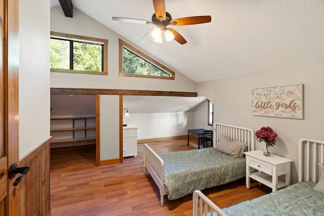 151 Handkerchief Creek Dr, Kalispell, MT 59901 - bedroom with vaulted ceiling, wood finished floors, and ceiling fan