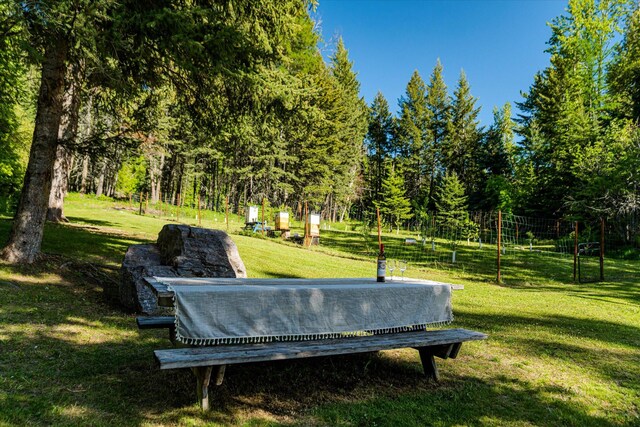 151 Handkerchief Creek Dr, Kalispell, MT 59901 - view of green lawn featuring an outdoor fire pit