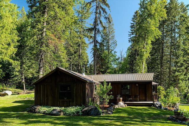 151 Handkerchief Creek Dr, Kalispell, MT 59901 - view of outbuilding featuring a wooded view