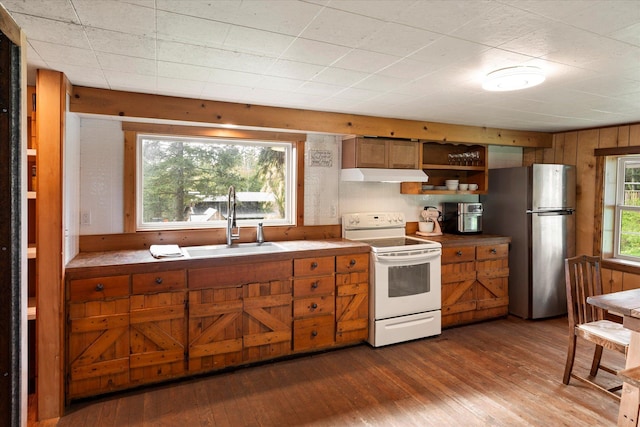 151 Handkerchief Creek Dr, Kalispell, MT 59901 - kitchen featuring white electric range oven, under cabinet range hood, freestanding refrigerator, dark wood-style flooring, and brown cabinets