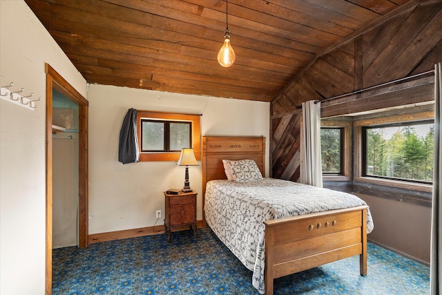 151 Handkerchief Creek Dr, Kalispell, MT 59901 - bedroom with multiple windows, wooden ceiling, lofted ceiling, and carpet flooring
