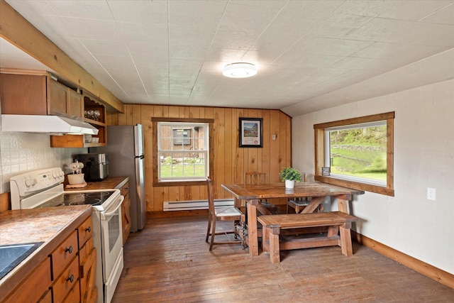 151 Handkerchief Creek Dr, Kalispell, MT 59901 - kitchen with white electric range oven, extractor fan, a baseboard radiator, dark wood finished floors, and wooden walls