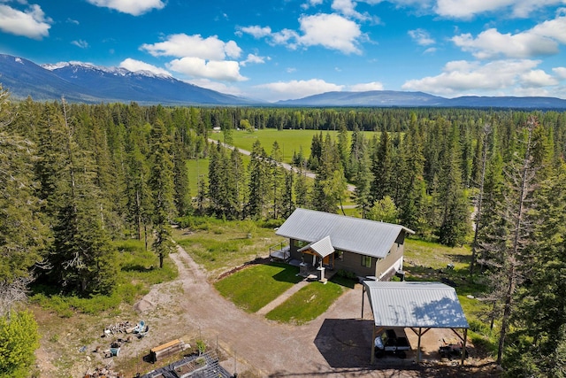 4111 Foothill Rd, Kalispell, MT 59901 - aerial view of property and surrounding area featuring mountains and a forest
