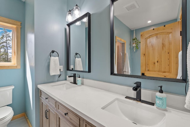 4111 Foothill Rd, Kalispell, MT 59901 - bathroom featuring double vanity and recessed lighting