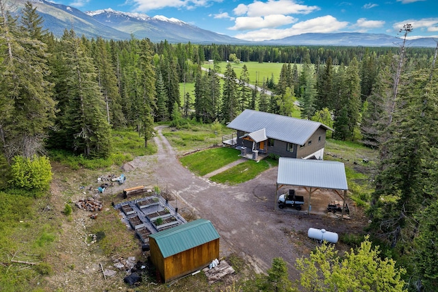 4111 Foothill Rd, Kalispell, MT 59901 - view of subject property with a mountain backdrop and a heavily wooded area
