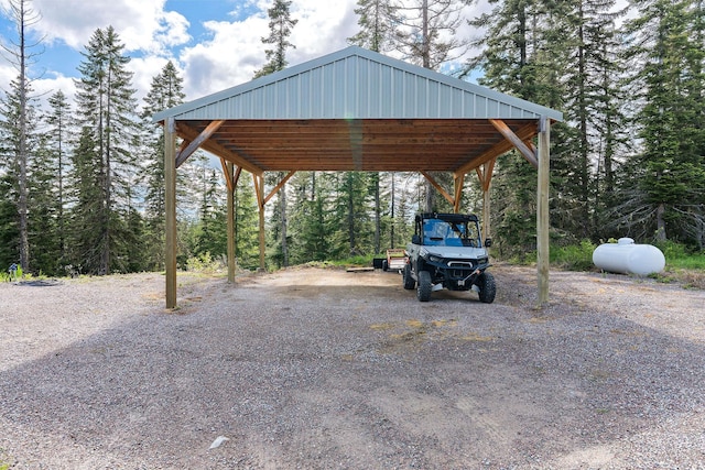 4111 Foothill Rd, Kalispell, MT 59901 - view of car parking featuring asphalt driveway and a carport