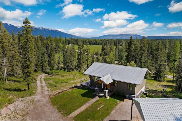 4111 Foothill Rd, Kalispell, MT 59901 - view from above of property with a mountain backdrop and a forest